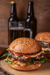 Tasty burgers on table