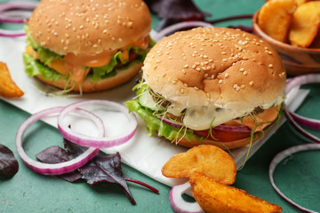 Tasty burgers on table, closeup