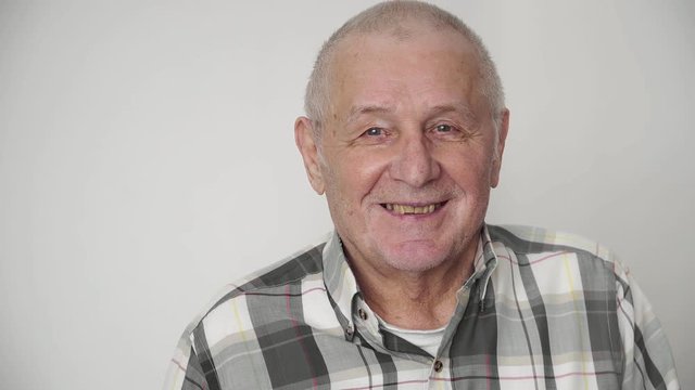 Portrait of a happy grey-headed man in 80s happy smiling retirement concept 4k