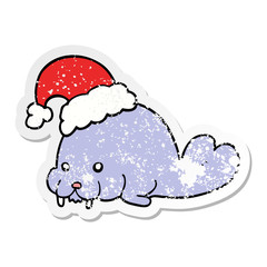 distressed sticker of a cartoon christmas walrus