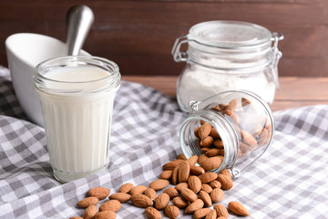 Composition with healthy almond milk on table