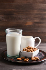 Composition with healthy almond milk on table