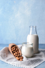 Composition with healthy almond milk on table