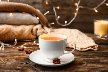 Cup of hot tea on wooden table