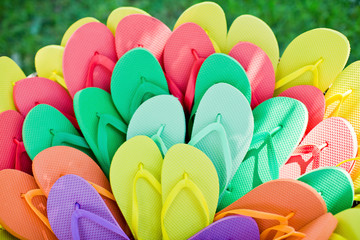 basket with colorful flip-flops