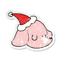distressed sticker cartoon of a elephant face wearing santa hat
