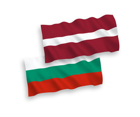National vector fabric wave flags of Latvia and Bulgaria isolated on white background. 1 to 2 proportion.