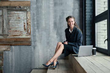 businessman sitting on bench and talking on cell phone