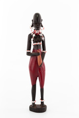 Wooden figure of a Maasai woman on white background