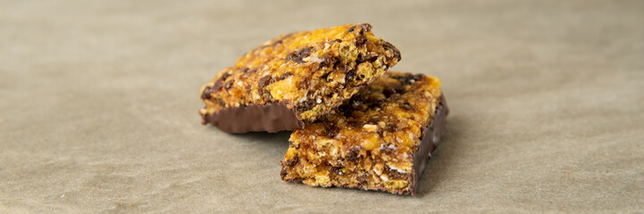 Muesli and cereal bar on marble stone background