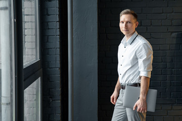 portrait of man standing in front of a building