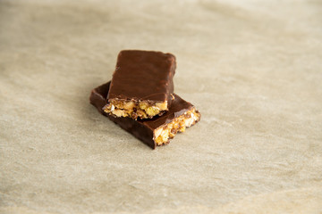Muesli and cereal bar on marble stone background