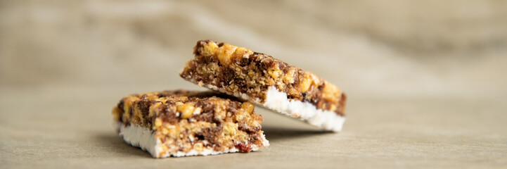 Muesli and cereal bar on marble stone background
