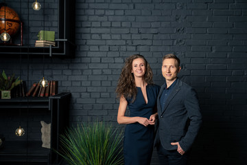 man and woman in office