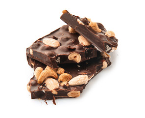 Tasty dark chocolate with nuts on white background
