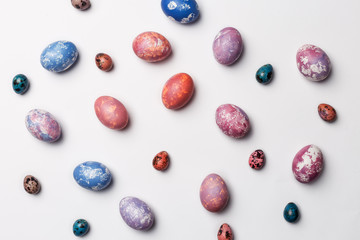 Stylish frame with colorful Easter eggs isolated on white background. Flat lay, Top view. Easter concept. Free space