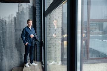 businessman standing in corridor