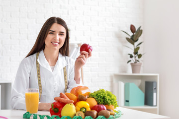 Portrait of female nutritionist in her office