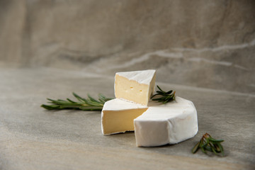 Cheese camembert or brie with fresh rosemary