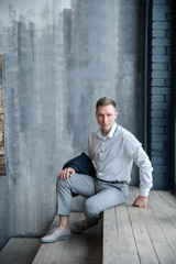 young man sitting on the floor