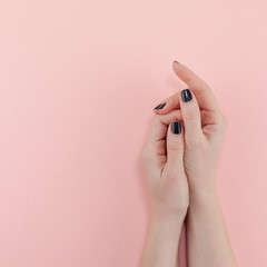 Woman's hands with black manicure