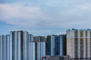 Type of buildings. View of the city from a height. Construction house. Residential area. Modern architecture.