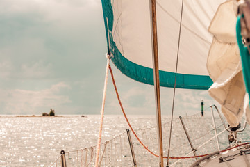 Yachting on sail boat during sunny weather