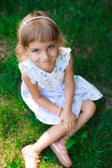 Llittle girl child outdoor in summer day.