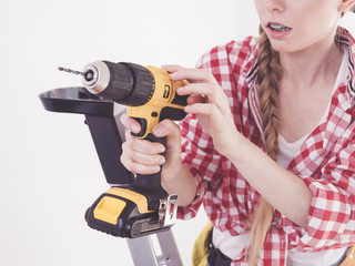Hand holding yellow drill