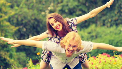 couple having fun piggyback riding