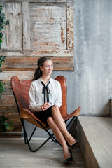 young woman sitting on bench