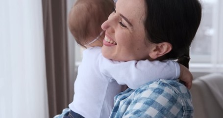 Mother with cute baby daughter at home