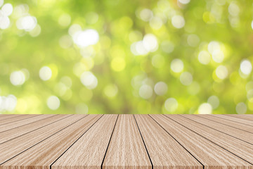 abstract blurred green nature with plank table for show,promote,ad product on image concept