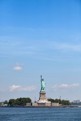 Statue of Liberty against the blue sky, New York, USA.