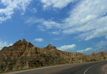 Gorgeous clouds above pinnacles and canyons at the Badlands National Park in South Dakota.