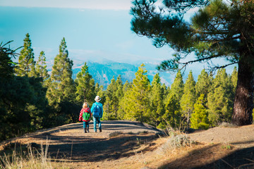 Obraz premium kids -boy and girl -travel in nature, family hiking