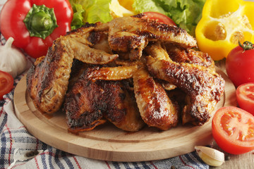 Chicken wings barbecue with different vegetables