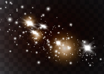 The dust sparks and golden stars shine with special light. Vector sparkles on a transparent background. Christmas light effect.
