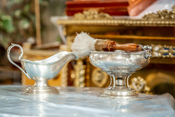 sacred water in the bowl. Tools for baby baptism. Catholicism, the concept of Christianity