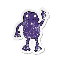 retro distressed sticker of a cartoon poisonous frog