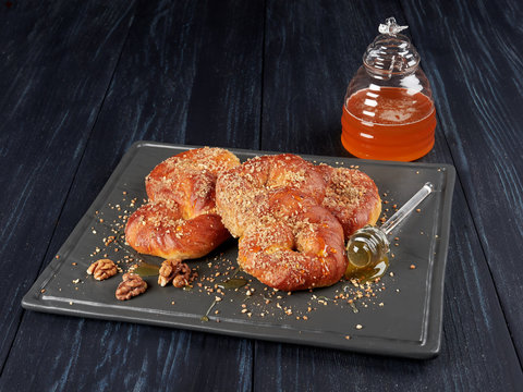 Romanian mucenici from Moldova region: figure eight shaped sweet bread, sprinkled with honey and crushed nuts. Traditional dessert for the Christian feast of the 40 Martyrs of Sebaste