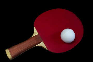 table tennis black racket and ball isolated on black background
