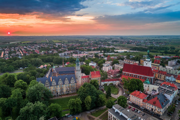 Fototapeta na wymiar Oleśnica castle with city panorama at the sunset aerial view