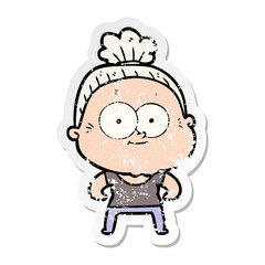 distressed sticker of a cartoon happy old woman