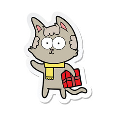 sticker of a happy cartoon cat with christmas present