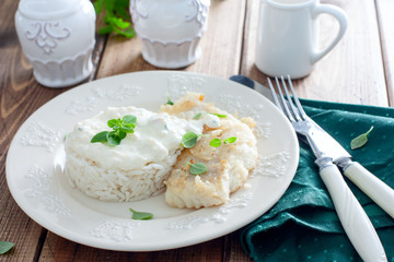 Fried cod, cooked with rice and cream sauce, horizontal