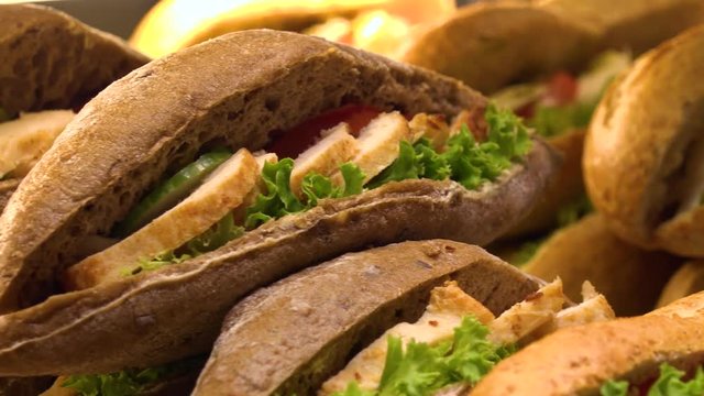 Closeup on sub sandwiches on display on a counter in a store