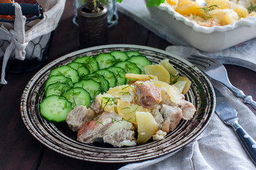 Roast pork with potatoes, selective focus