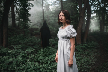 Female victim and death in black hoodie in forest