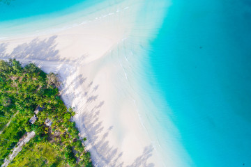 Aerial view of idyllic tranquil sea island deep blue turquoise water